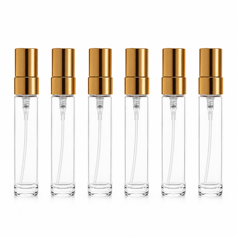 Seis atomizadores de vidrio transparente de 5 ml con tapa dorada