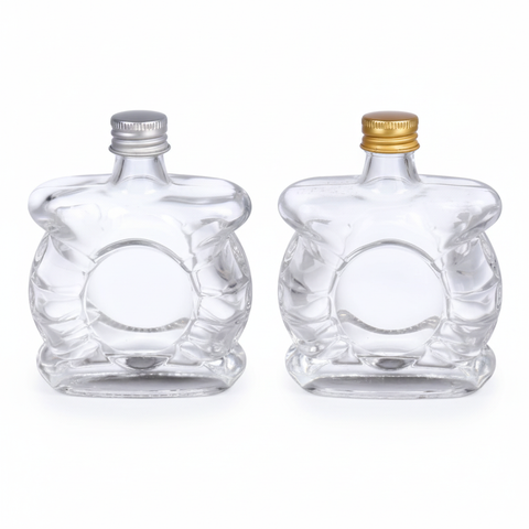 Dos botellas de vidrio corazón 50ml con tapas variadas