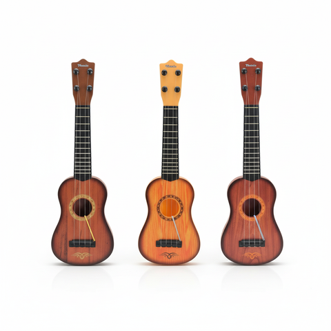 Ukeleles de juguete sobre fondo blanco
